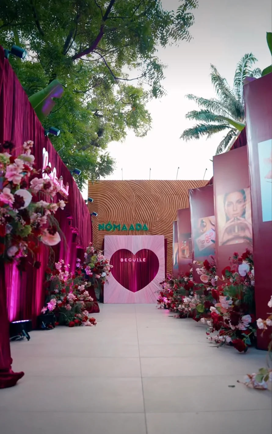Golden Kiss launch: a flower-lined walkway leading to a Beguile heart installation
